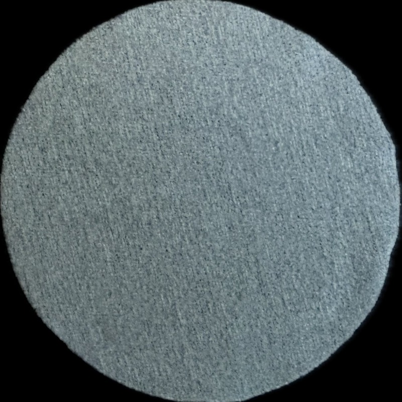 Nike Pro dark grey fabric swatch, circular cut-out on black